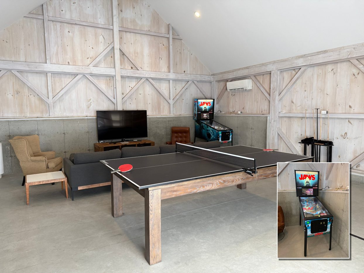 Inside the Game Barn: ping-pong table, sofa and a large TV, with the pinball machine shown in an inset